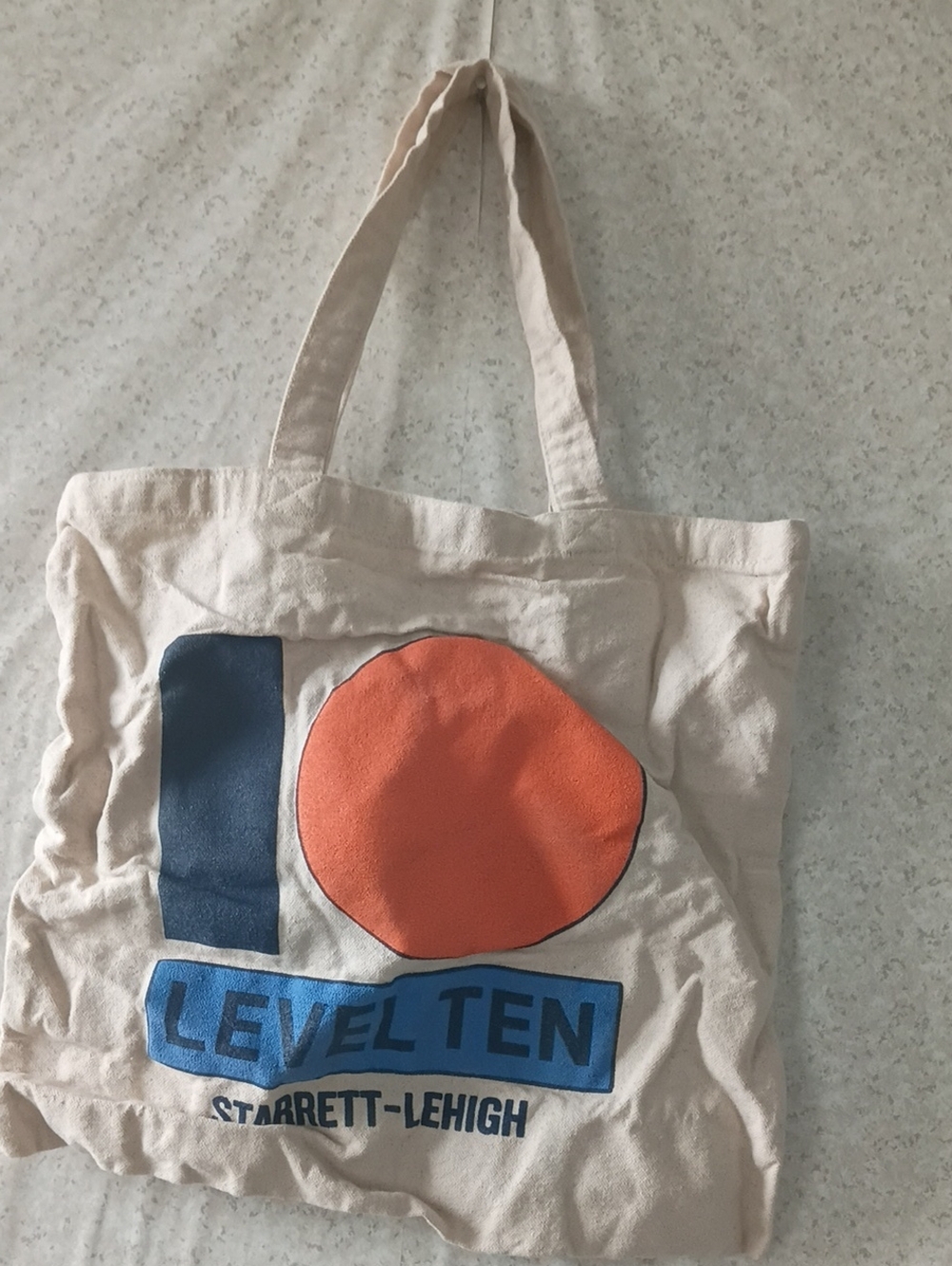 Women's Cream Canvas Tote with Blue and Orange Graphic